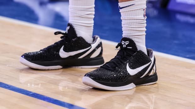 View of black and white Nike Kobe shoes.